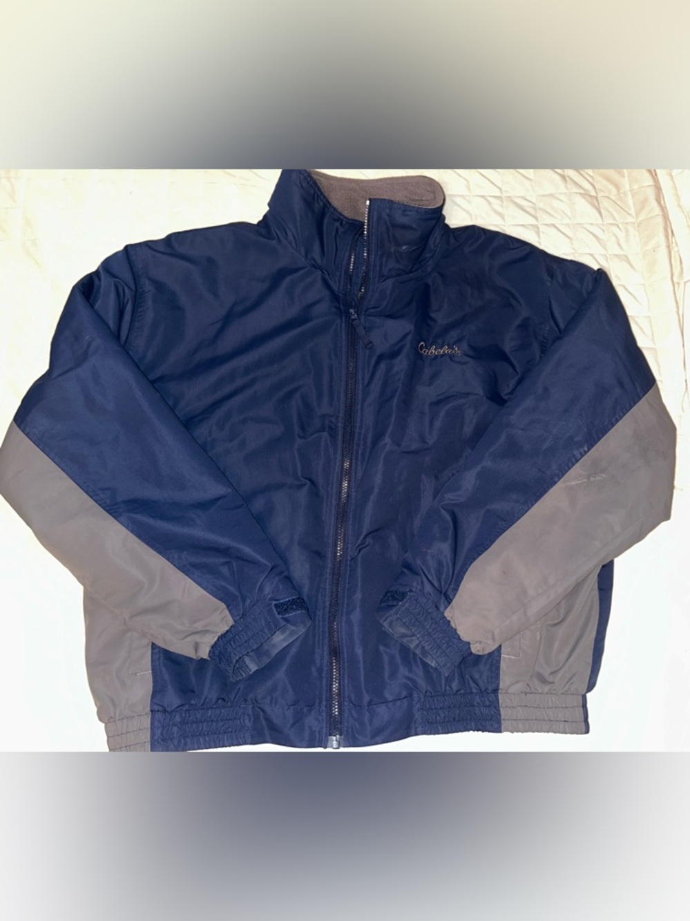 Cabela’s Mens XL nylon and fleece lined jacket. Has blemishes (see pictures)